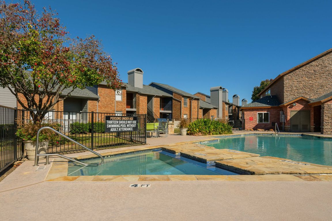 Refreshing Pool and Hot Tub in Carrollton Apartment Community