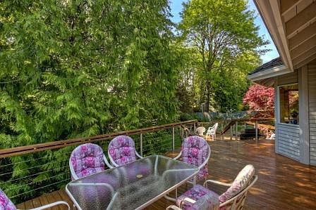 The wrap-around deck (approx 1000 sq ft of two levels) is a gorgeous addition to your summer evening