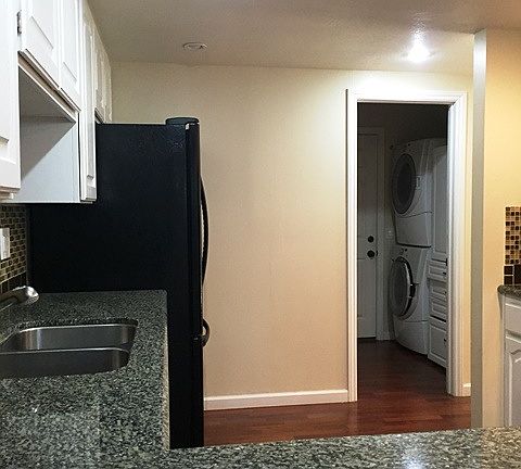 kitchen and view of laundry area