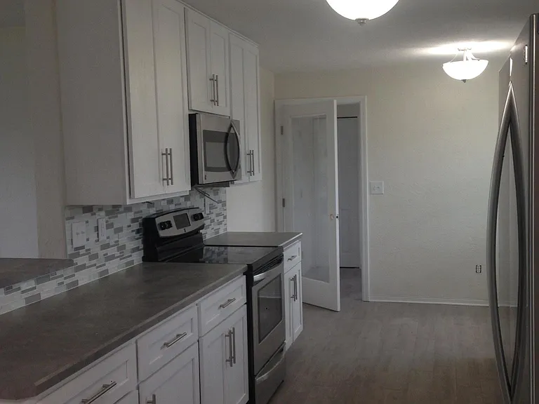 looking from dinning through kitchen to laundry