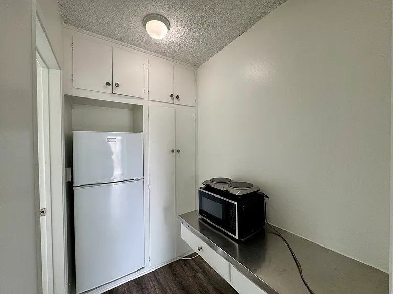 All photos are actual photographs of a comparable unit with a similar floor plan and finish style, shown for reference only.