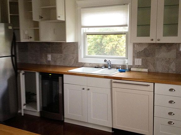 Kitchen with wine frig, dishwasher, gas range