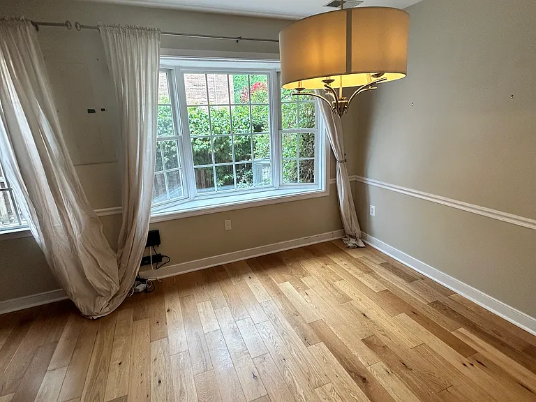 Dining with bay windows overlooking patio