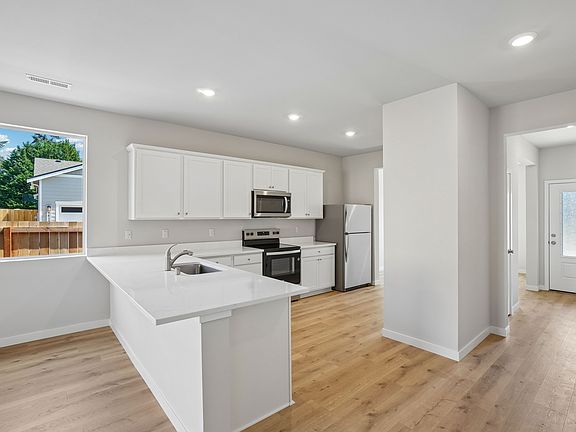 The kitchen seamlessly connects to the living space.