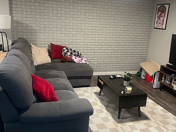 Exposed brick wall in living room