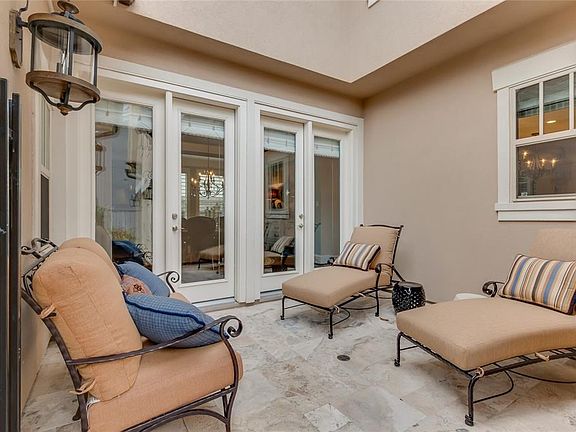 Side courtyard provides a secondary entry point from the driveway