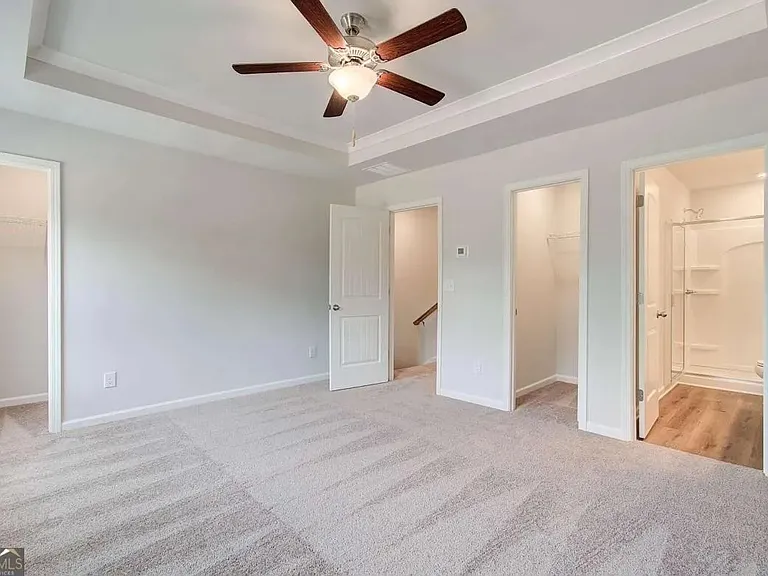 Master bedroom w/ two closets
