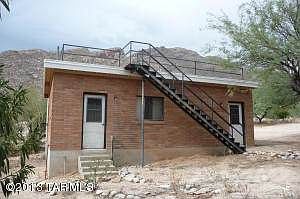 Side of garage with stairs to roof deck