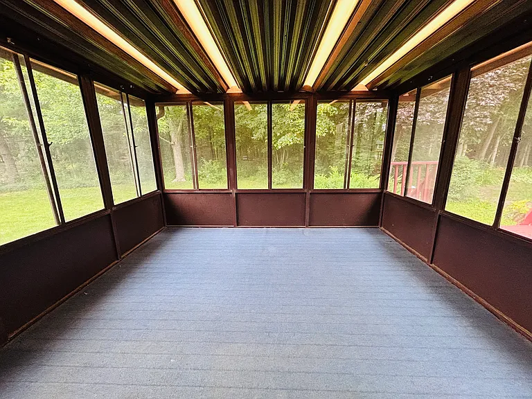 Sunroom with view to back yard