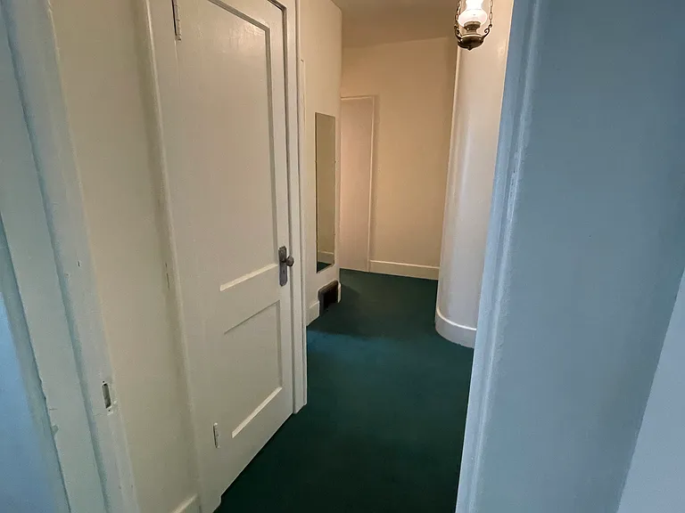 Hallway with storage closets