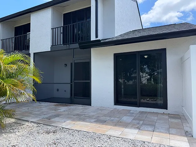 Back yard patio with privacy fence each side. Upper balcony & storage closet off Guest bedroom #2