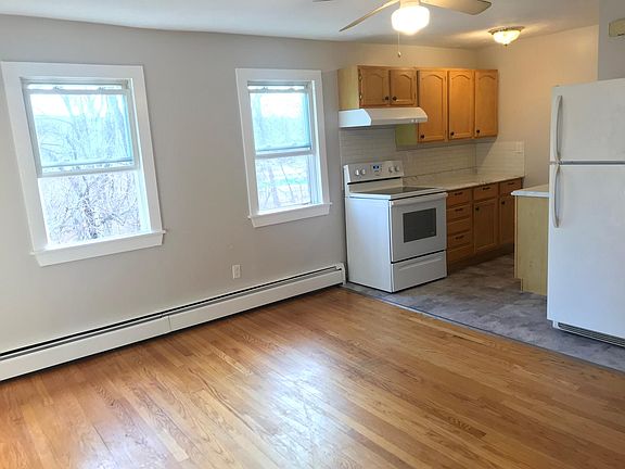 Living room opens up into kitchen area.