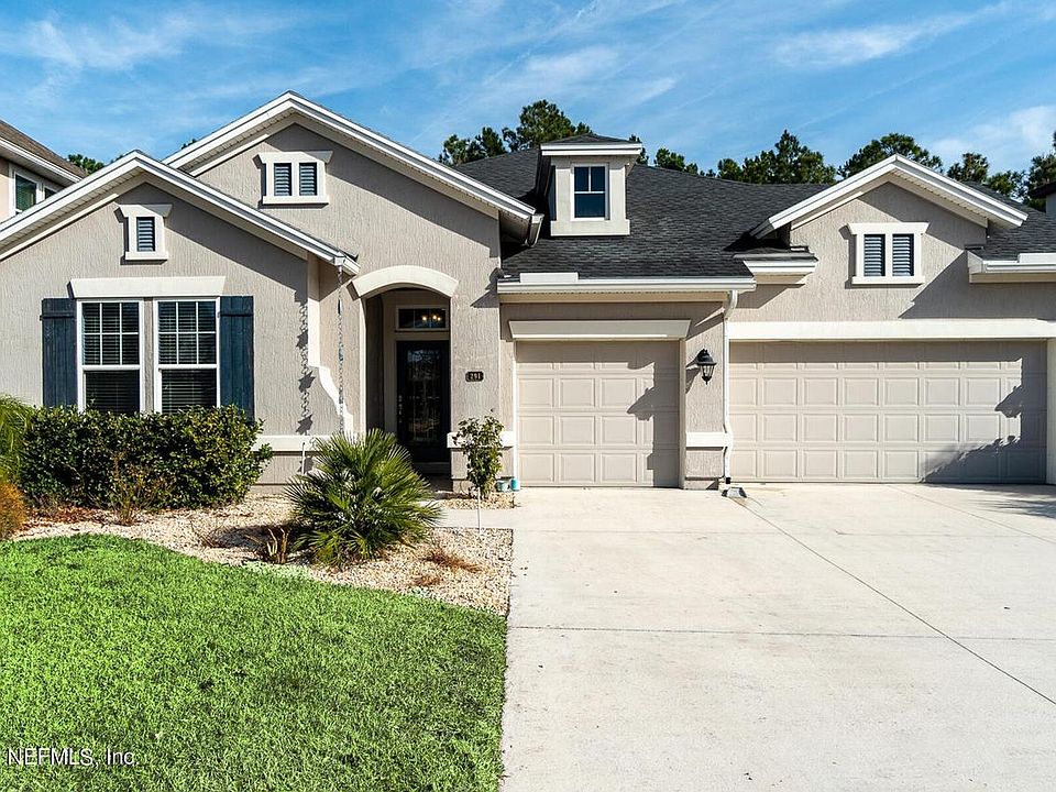 Single story 3 car garage house back to a nature preserve