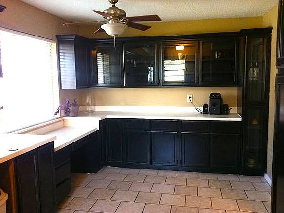 Eating area with builtin buffet and glass front cabinets