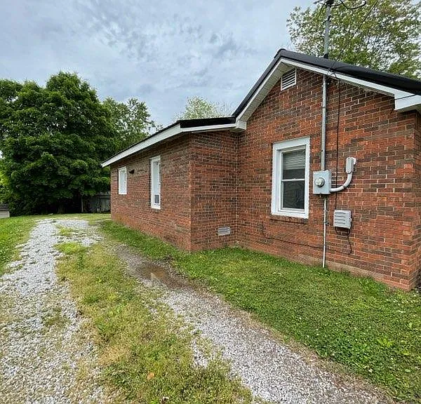 Side Exterior - grass killed and new gravel after photo was taken.