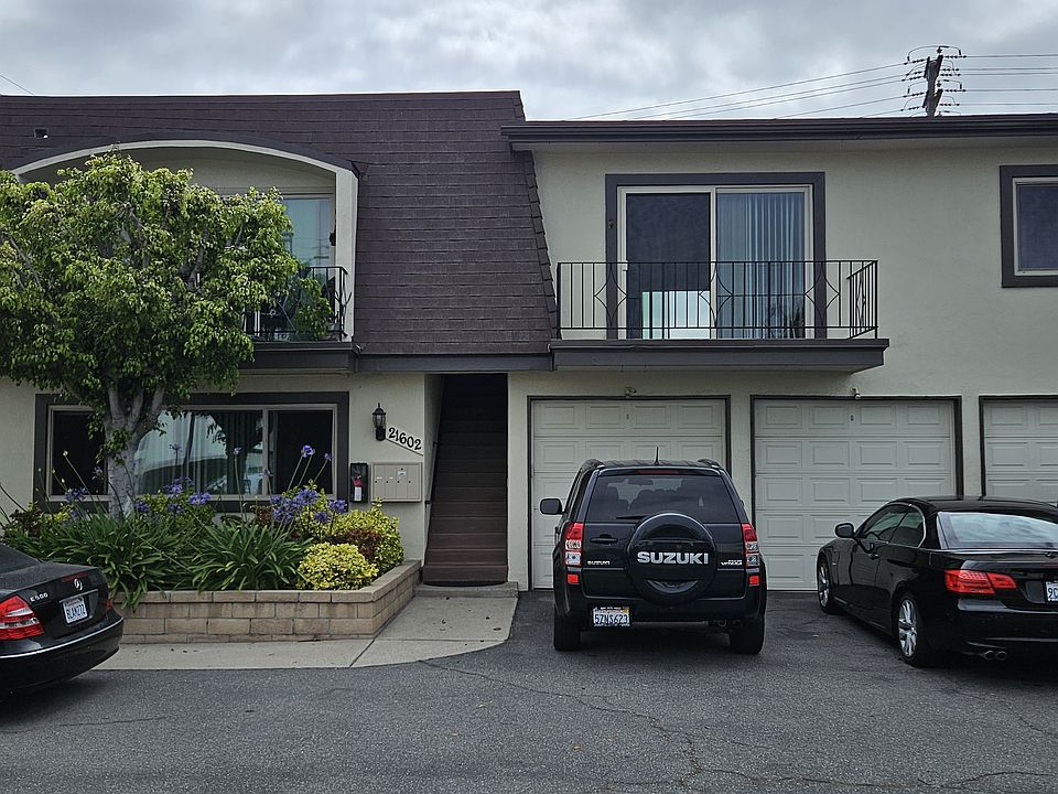Building showing upstairs apartment over garages