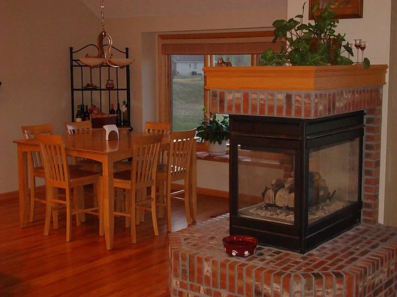 Kitchen with lake view and open fireplace