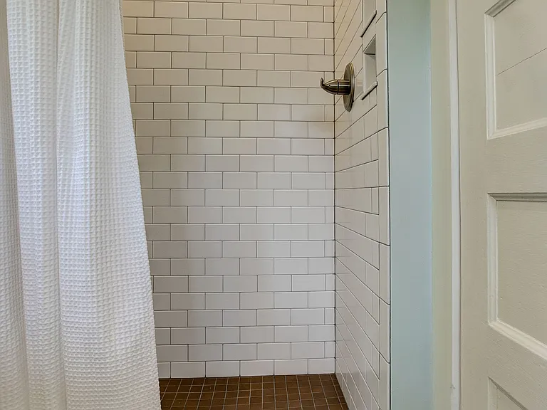shower on north wall of bathroom