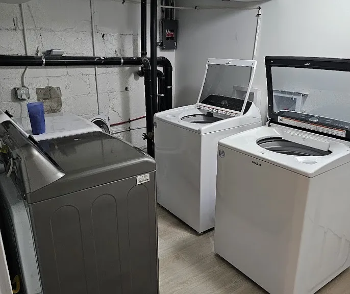 Shared laundry room (with 1 other unit) in basement