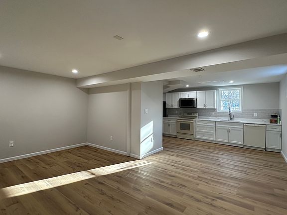 renovated kitchen, new cabinets, fridge, microwave
