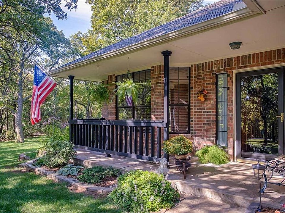 Front Veranda overlooking live oaks in a park like setting