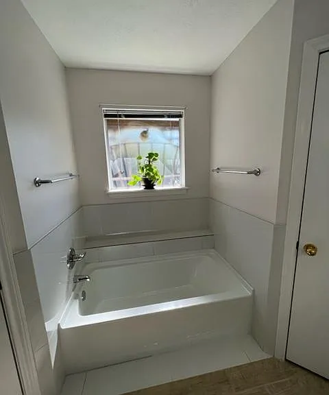 brand new relaxing master tub with closets on either side