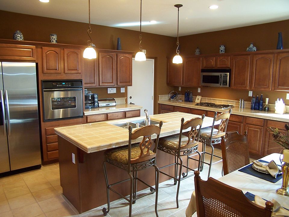 Stainless Steel Appliances and Maple Cabinets