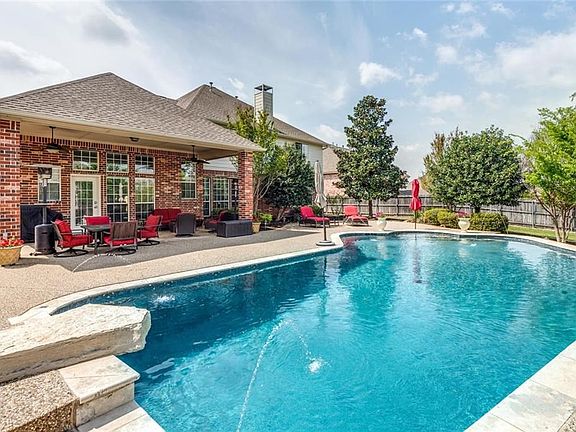 Rear Elevation. Large covered patio! Diving pool with dive rock!