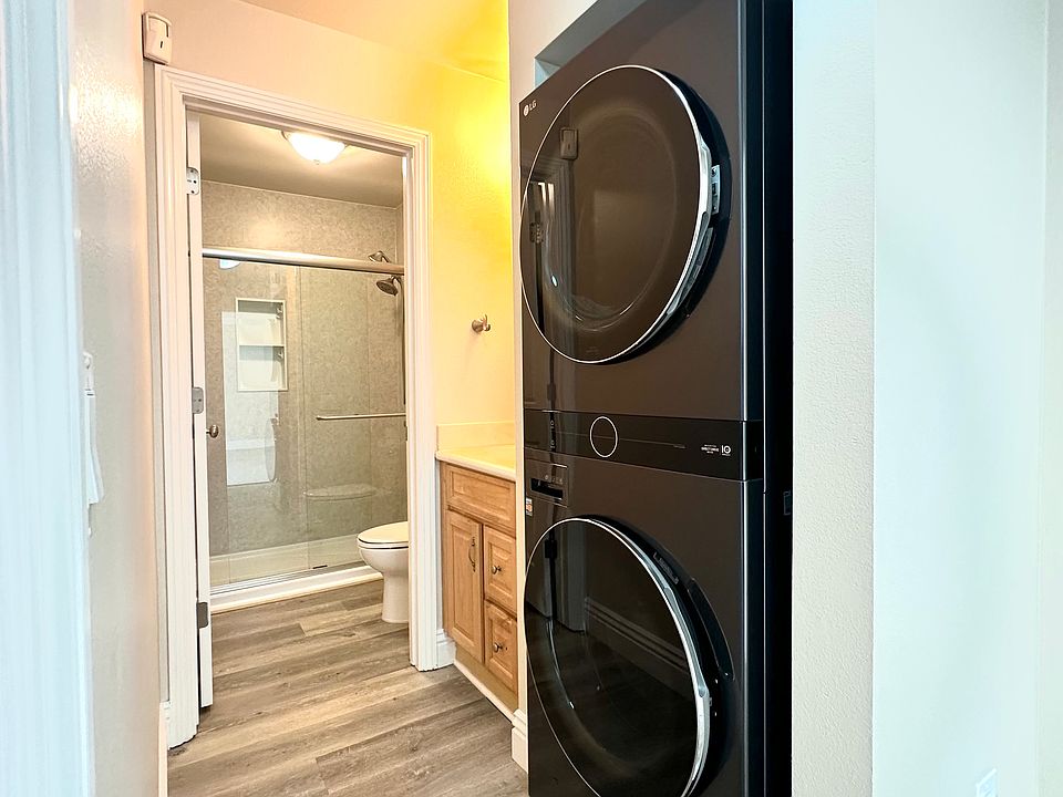 Washer/Dryer, Vanity area outside of bathroom and entrance to bathroom