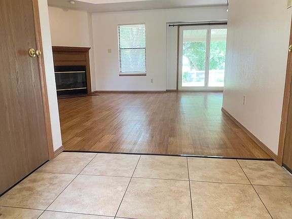 Spacious Entry into Home with Coat Closet to the left and door leading to Garage on right.