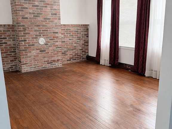 Dining Room or Bonus Room (between kitchen and living room). Curtains can stay with house or we can take them down.