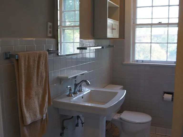 Vintage style tile bath, linen closet