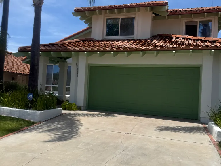 Front, with oversize 2 car garage with washer and dryer; additional overhead storage and plenty of room for racks.