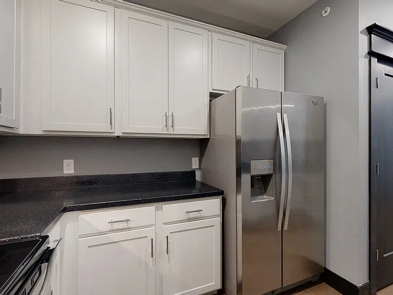 A modern kitchen with bright cabinetry and sleek finishes makes every meal feel like an experience.
