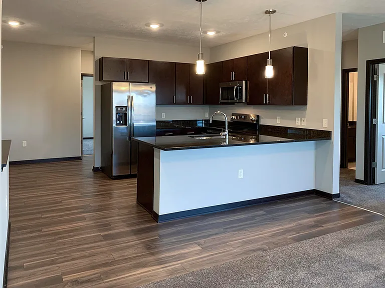Open-concept layouts connect the kitchen and dining areas, providing a seamless space to relax or gather.