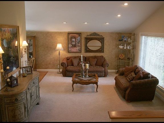 Large formal living room with vaulted ceiling (recessed lighting throughout)