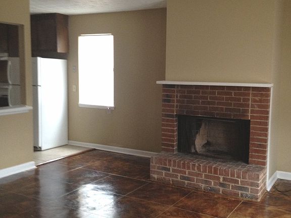 Living Room w Fireplace and Stained Concrete Floors