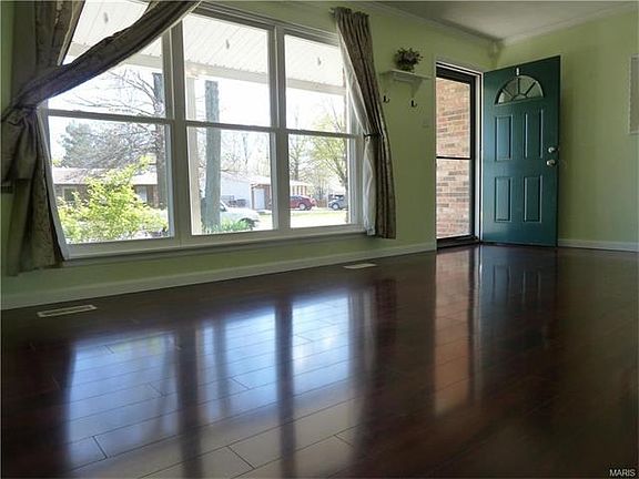 19 x 13 living room. The high quality laminate flooring is about 4 yrs old and all the double pane thermal windows are about 2 yrs old. New baseboards where added when the flooring was installed.