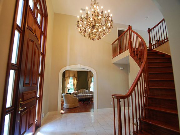 Foyer - marble floor, circular staircase