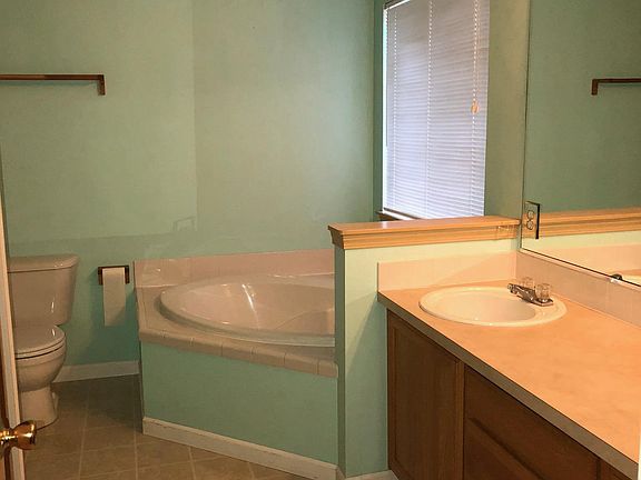 Peaceful 5 piece Master Bathroom with large soaking tub and 