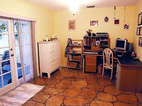 3rd bedroom or office with French doors leading to porch.
