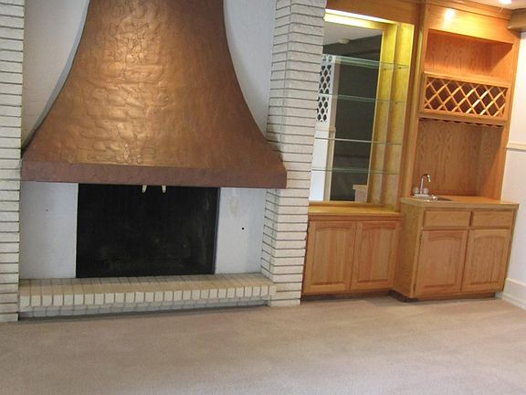 View of fireplace and bar