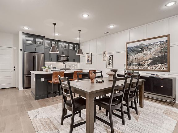 Open concept- fully upgraded kitchen with trash roll out cabinet in island.