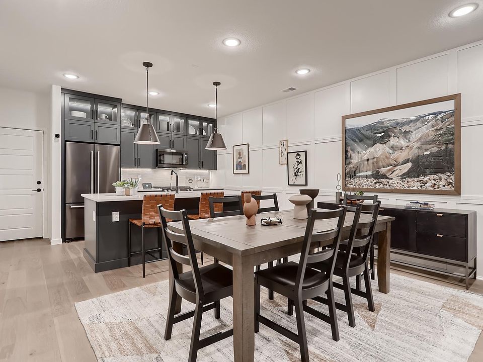 Open concept- fully upgraded kitchen with trash roll out cabinet in island.
