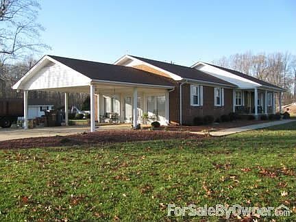 Carport Attached to house, paved drivewa