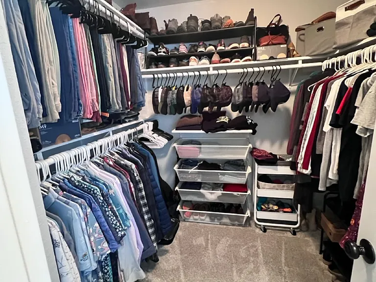 Primary bedroom walk-in closet