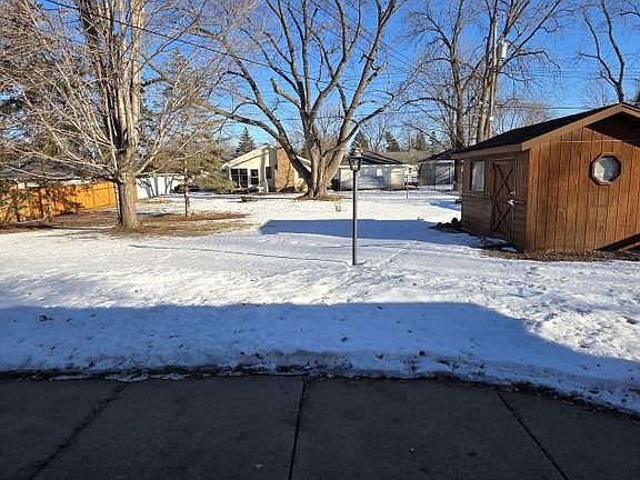 Large yard, yard shed, clothes line and concrete patio.