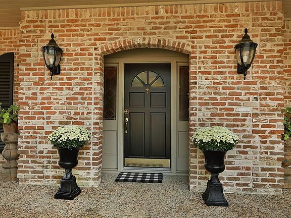 Welcoming front door and charming porch