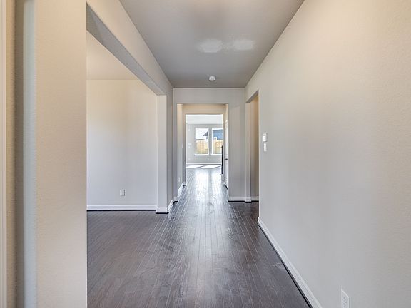 Foyer featuring a study, dining room and entryway into an open concept living space