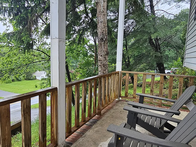 Rocking chair front porch perfect for enjoying a morning cup of coffee overlooking the hills
